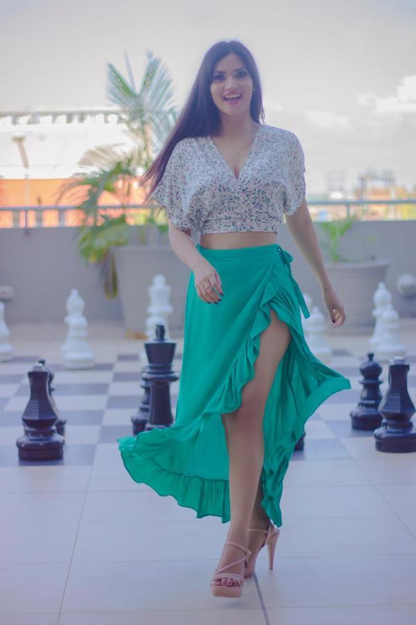 Costa del Sol Wyndham Pucallpa Esterno foto A woman wearing a wrap skirt